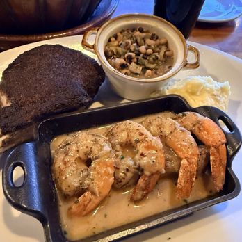 Fahrenheit 132 - Pork chop shrimp, scampi, Black Eyed Peas and he had a small side of mashed potatoes - Steakhouses Near Me - Fredericksburg, Virginia