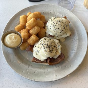 Their There - Bacon Benedict with tater tot's. - Breakfast & Brunch Near Me - Vancouver, British Columbia Their There - Bacon Benedict with tater tot's. - Breakfast & Brunch Near Me - Vancouver, British Columbia