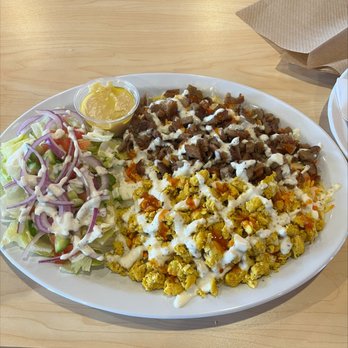 Halal Basket - a plate of food on a table - Mediterranean Near Me - San Marcos, Texas Halal Basket - a plate of food on a table - Mediterranean Near Me - San Marcos, Texas