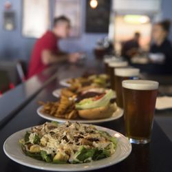 Enjoy delicious burgers, sandwiches, pizza, salads, and a full bar at Coasters Bar & Grill, inside the Boardwalk Bowl in Santa Cruz