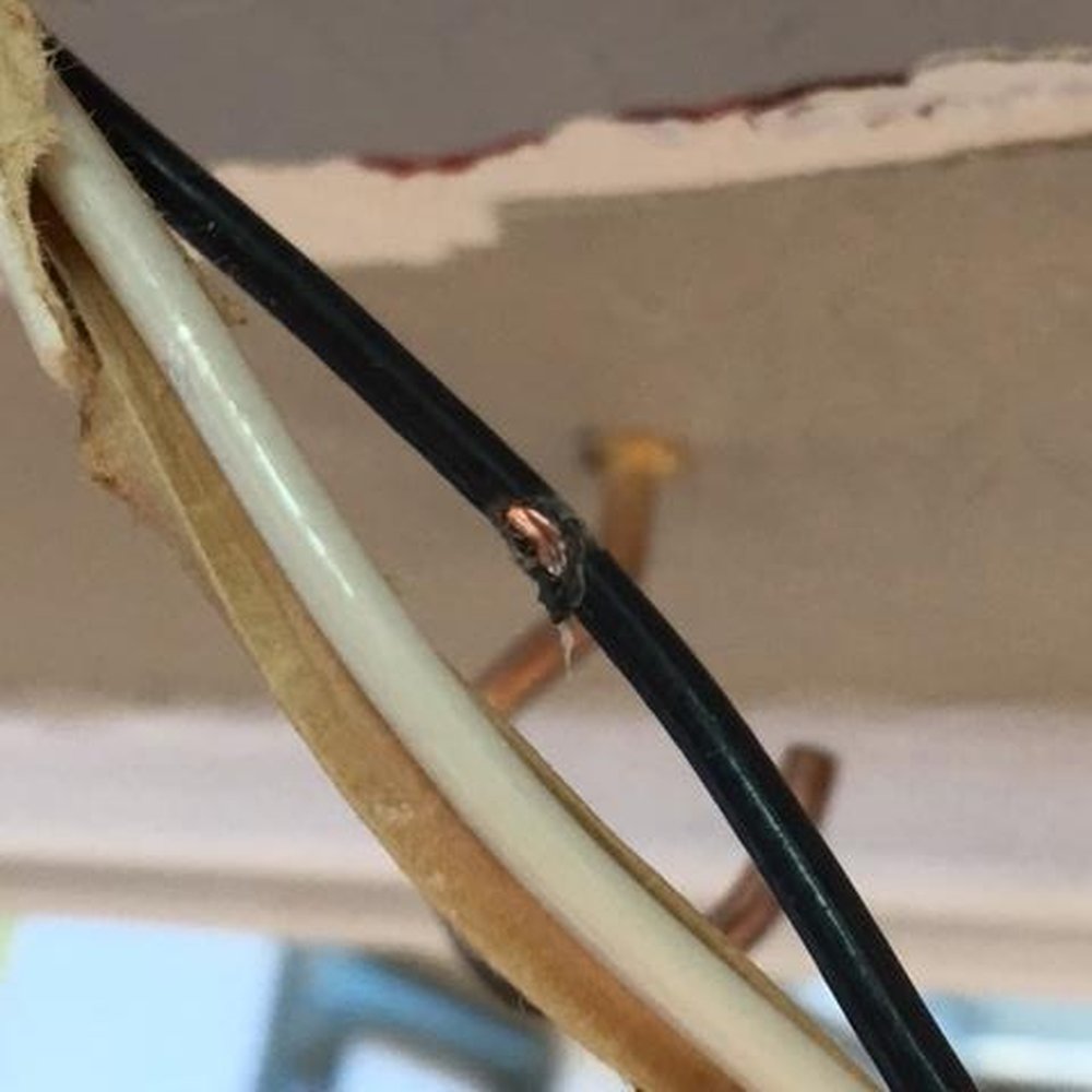 Current Power Electric - Window company screwed right in the middle of the Romex. Black cover was damaged and hot wire was exposed in the wall. - Electricians Near Me - Winchester, California Current Power Electric - Window company screwed right in the middle of the Romex. Black cover was damaged and hot wire was exposed in the wall. - Electricians Near Me - Winchester, California