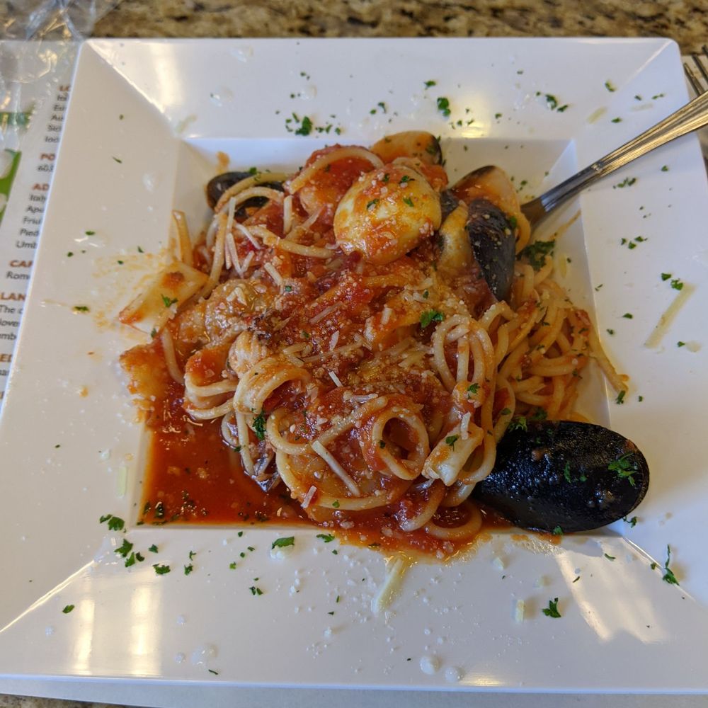 a plate of pasta and musselling a plate of pasta and musselling