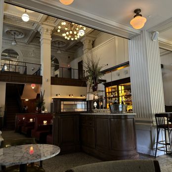 the LUKE BRASSERIE - a view of a bar with a chandelier - Brasseries Near Me - New Haven, Connecticut the LUKE BRASSERIE - a view of a bar with a chandelier - Brasseries Near Me - New Haven, Connecticut