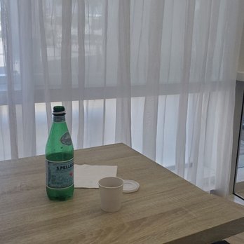 Bagel Express - a bottle of water on a table - Bagels Near Me - Aventura, Florida Bagel Express - a bottle of water on a table - Bagels Near Me - Aventura, Florida