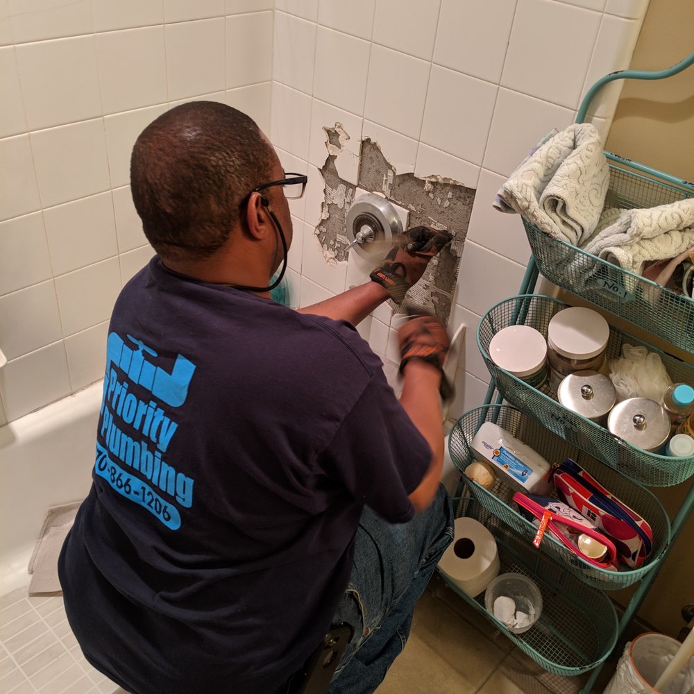 A Plus Priority Plumbing - Ray, the owner of A Plus Priority Plumbing, starting work on replacing my shower and tub valve. It required the demolition of 9 tiles. - Plumbing Near Me - Atlanta, Georgia A Plus Priority Plumbing - Ray, the owner of A Plus Priority Plumbing, starting work on replacing my shower and tub valve. It required the demolition of 9 tiles. - Plumbing Near Me - Atlanta, Georgia