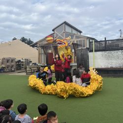 American International Montessori - Dragon dance by upper elementary students for Lunar New Year celebration.