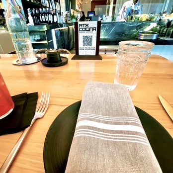 ATX Cocina - QR code to access the menu. Masked bartender mixing drinks. - Mexican Near Me - Austin, Texas