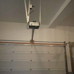 Garage door mechanism and electrical wires Garage door mechanism and electrical wires
