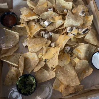 BJ's Restaurant & Brewhouse - The nachos with three nachos eaten. - New American Near Me - Tyler, Texas