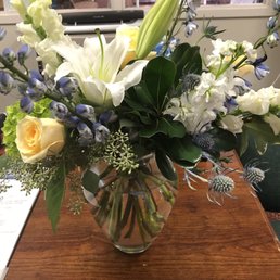 A bunch of flowers thrown together - embarrassingly ugly although at least this 2nd time it came back the 3 roses weren't dead