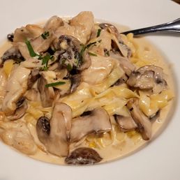 Cremini fettuccine pasta in cream sauce with truffle oil. Added chicken to this. Highly recommended.