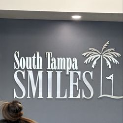 South Tampa Smiles - Logo at the front desk