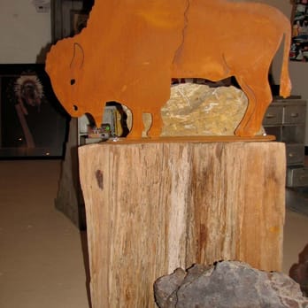 The Copper Gecko - rusted metal bison on tree stump - Antiques Near Me - Superior, Arizona