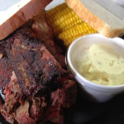 Pig In Pig Out - Ribs & Brisket with potato salad and corn.