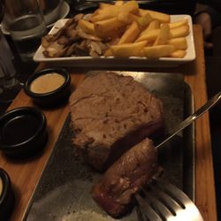 The Watermill - 8oz. Filet mignon. On hot stone. This works better keeping on hot stone as it's a thicker cut.