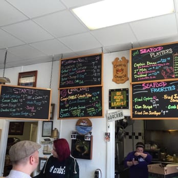 Casey's Crab Company - The menu is on the board and it's very colorful! - Seafood Near Me - Laurel, Maryland