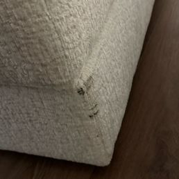 Ottoman arrived with black stains.