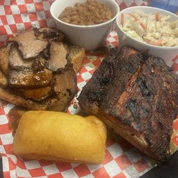 Baby back ribs and brisket baked beans and coleslaw with cornbread Baby back ribs and brisket baked beans and coleslaw with cornbread
