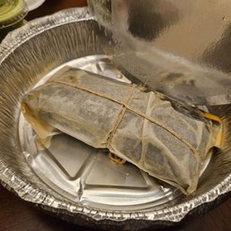 Tamal...great flavor but the chicken filling could be more Tamal...great flavor but the chicken filling could be more