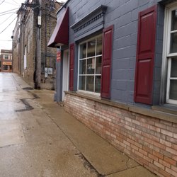 Holland Hardware - View walking from W Hinsdale Ave, up alleyway, to store.