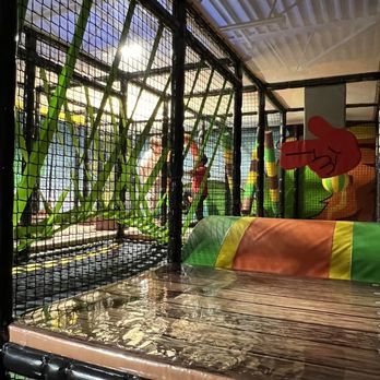 Dinoland - the inside of a caged enclosure - Indoor Playcenter Near Me - Dearborn Heights, Michigan
