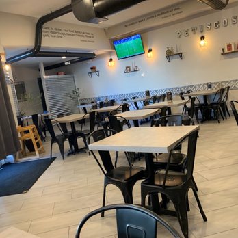 No Pao! 100 Reservas - tables and chairs in a restaurant - Portuguese Near Me - Newark, New Jersey No Pao! 100 Reservas - tables and chairs in a restaurant - Portuguese Near Me - Newark, New Jersey