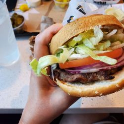 Charburger with raw onions.
