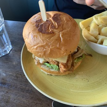 camocha - The beef and bird burger (beef, chicken fillet and cheese) with chips - Bistros Near Me - Camlough