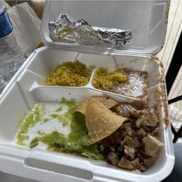 Asada combination Plate with pork (carnitas) and flour tortillas.