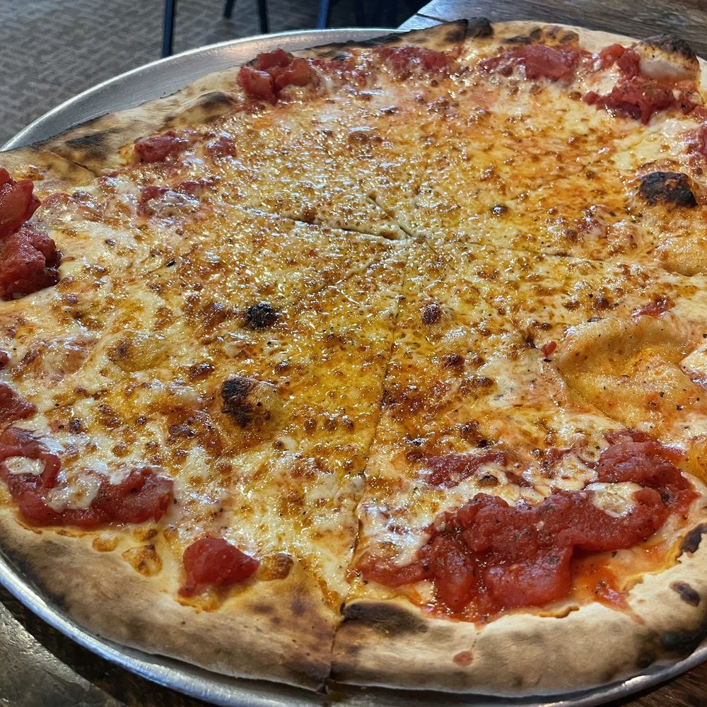 Our plain pizza. Cooked to perfection. Our plain pizza. Cooked to perfection.