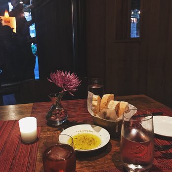 Mediterra Restaurant - Always such a lovely, warm setting.  Our complimentary bread + my negroni! (And our waters, lol). - Italian Near Me - Princeton, New Jersey