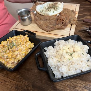 Clerico - a woman sitting at a table with plates of food - Argentine Near Me - Killeen, Texas Clerico - a woman sitting at a table with plates of food - Argentine Near Me - Killeen, Texas