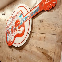 a guitar on the wall of a restaurant a guitar on the wall of a restaurant
