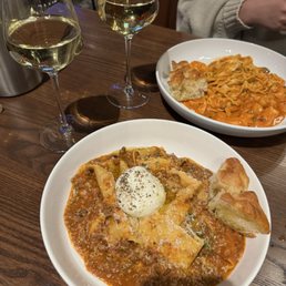 Pappardelle bolognese and tagliatelle di mar with some focaccia bread