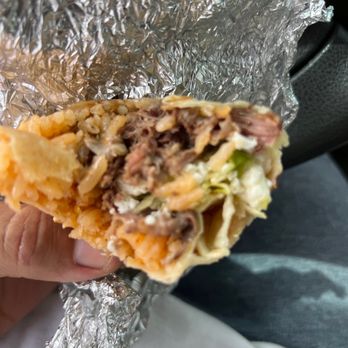Rubio's Mexican Food Store - a hand holding a burrito - Grocery Near Me - Mascotte, Florida Rubio's Mexican Food Store - a hand holding a burrito - Grocery Near Me - Mascotte, Florida