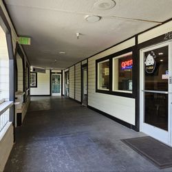 T-Kumi Ramen & Rice Bowl - Entrance with a small sign
