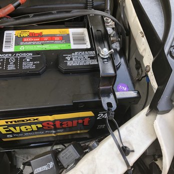 FDS Luxury Auto - Zip tie at bottom right of picture. Note the bracket that doesn't even correctly expand the complete top of the battery. - Used Car Dealers Near Me - San Antonio, Texas
