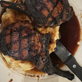 Malibu Grill - Charred black forged in fire pork chops. - New American Near Me - Bloomington, Indiana