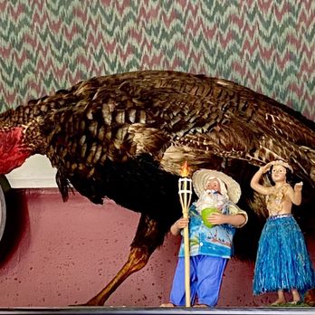 The Place Restaurant - Tropical Santa and Hula Girl fear for their lives as the ancient giant mutant turkey "Gobblera" rises from his sleep. - American Near Me - Malvern, Arkansas The Place Restaurant - Tropical Santa and Hula Girl fear for their lives as the ancient giant mutant turkey "Gobblera" rises from his sleep. - American Near Me - Malvern, Arkansas