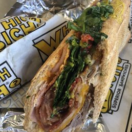 a sub sandwich on a wrapper a sub sandwich on a wrapper