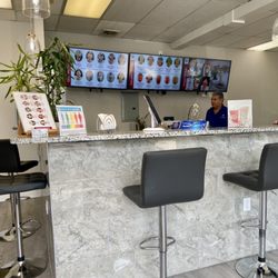 Fit Healthy Nutrition - Inside: Front counter and TVs with menu
