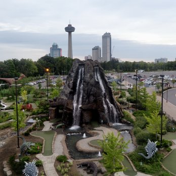 SkyWheel - View from Niagara SkyWheel: Clifton Hill's Dinosaur Adventure Golf, with Skylon Tower in the background - Amusement Parks Near Me - Niagara Falls, Ontario SkyWheel - View from Niagara SkyWheel: Clifton Hill's Dinosaur Adventure Golf, with Skylon Tower in the background - Amusement Parks Near Me - Niagara Falls, Ontario
