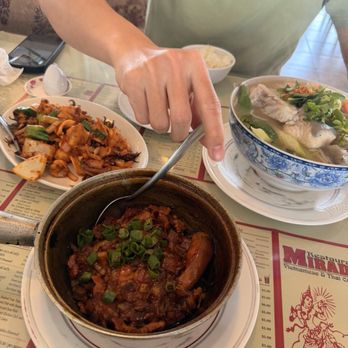 Mirada Restaurant - Ca Kho Tho (bottom) canh chua (right) muc xao(left) - Vietnamese Near Me - Fountain Valley, California Mirada Restaurant - Ca Kho Tho (bottom) canh chua (right) muc xao(left) - Vietnamese Near Me - Fountain Valley, California