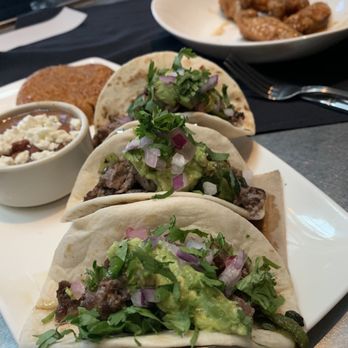 Yard House - (Left) Carne Asada Street Taco & (right) Gardein Wings** - New American Near Me - San Antonio, Texas