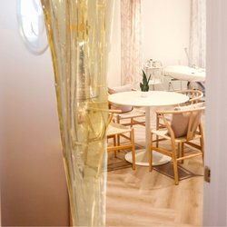 Sucré Body Sugaring Boutique - Sucre Body Sugaring's interior and seatings and table.