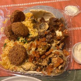 Picture taken after we dug in! Got the mixed grilled plate with rice, we also added an order of falafel- it normally comes with 2 falafel.