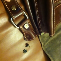 These tiny caps do nothing to secure a shoulder strap to a messenger bag meant to hold a laptop and books These tiny caps do nothing to secure a shoulder strap to a messenger bag meant to hold a laptop and books