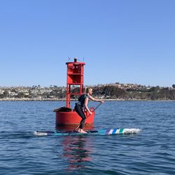 Ocean Academy - Kimberly conquering the harbor mouth buoy and saying hi to the sea lions.