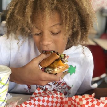 Rockit Char Grill - My son eating the other half of his burger... - Burgers Near Me - Hayward, California Rockit Char Grill - My son eating the other half of his burger... - Burgers Near Me - Hayward, California