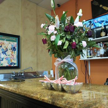 Crawford's 1-Stop - a vase of flowers on a counter - Salad Near Me - Slidell, Louisiana